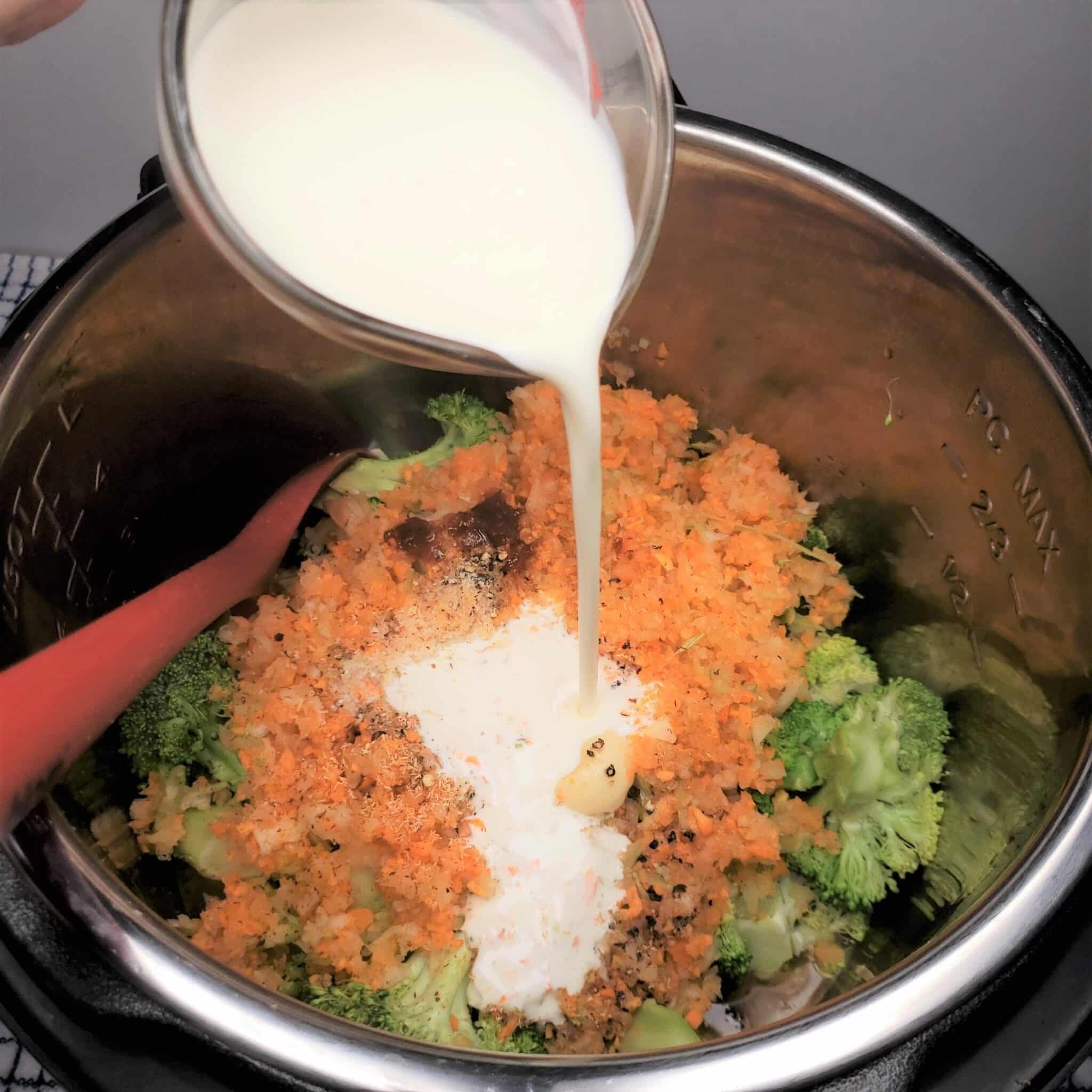 Pour Heavy Cream Over Broccoli and Carrot Mix
